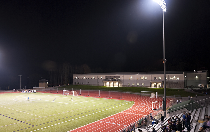 Exterior image of soccer field at night time.