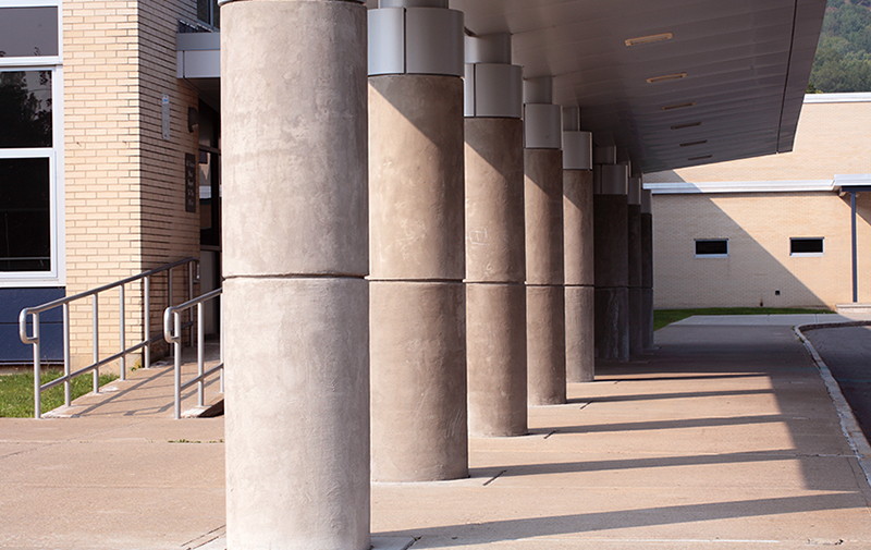 Exterior image of columns outside front entrance of building.