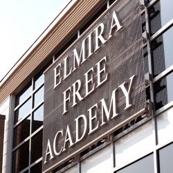 Exterior close up of Elmira Free Academy sign on building.