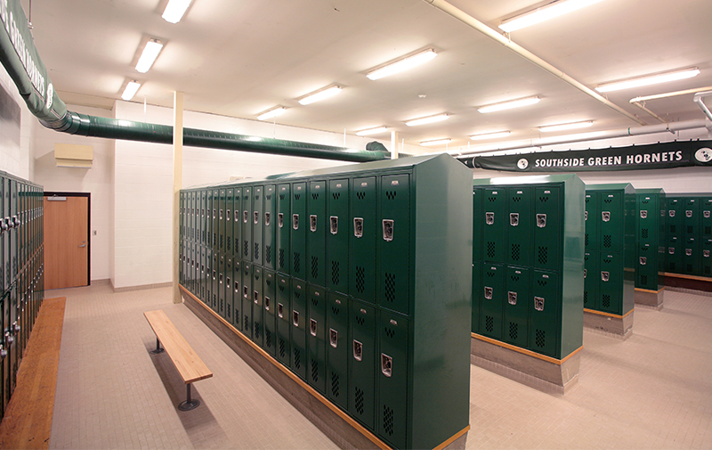 Interior image of locker room with green lockers.