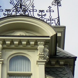 Close up image of rooftop elements of historic building.