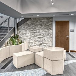 Interior view of the DEP lobby area inside the Catskill Watershed Corporation, featuring a welcoming reception space with seating and environmental-themed decor.