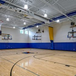 Interior view of the Little Britain Elementary School gym in Washingtonville Central School District, featuring athletic space for student physical activities.