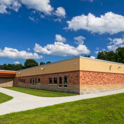 Exterior entrance of Round Hill Elementary School in Washingtonville, NY, featuring its welcoming design and main entryway.