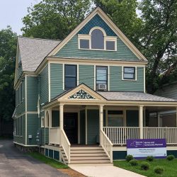 Exterior view of 10 Edwards Street, a newly renovated house providing affordable housing as part of the North of Main Revitalization Project.