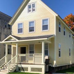 Exterior view of 15 Mather Street, a newly renovated house providing affordable housing as part of the North of Main Revitalization Project.